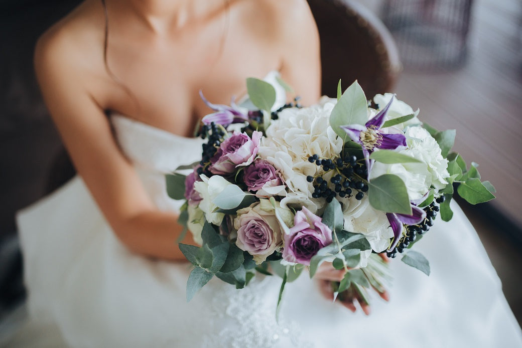 Bride holding a modern day bridal bouquet on her wedding day